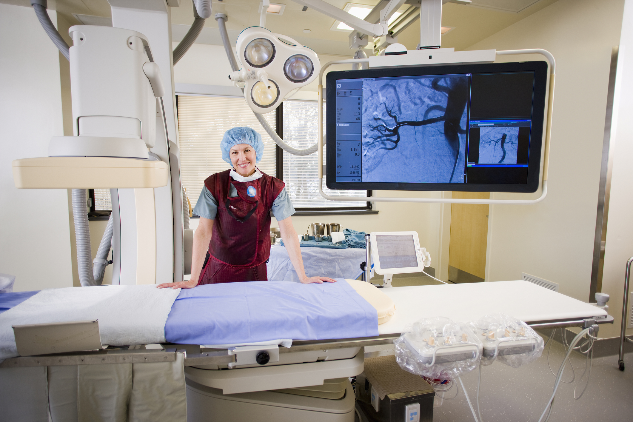 Portrait of technologist in interventional Radiology Suite