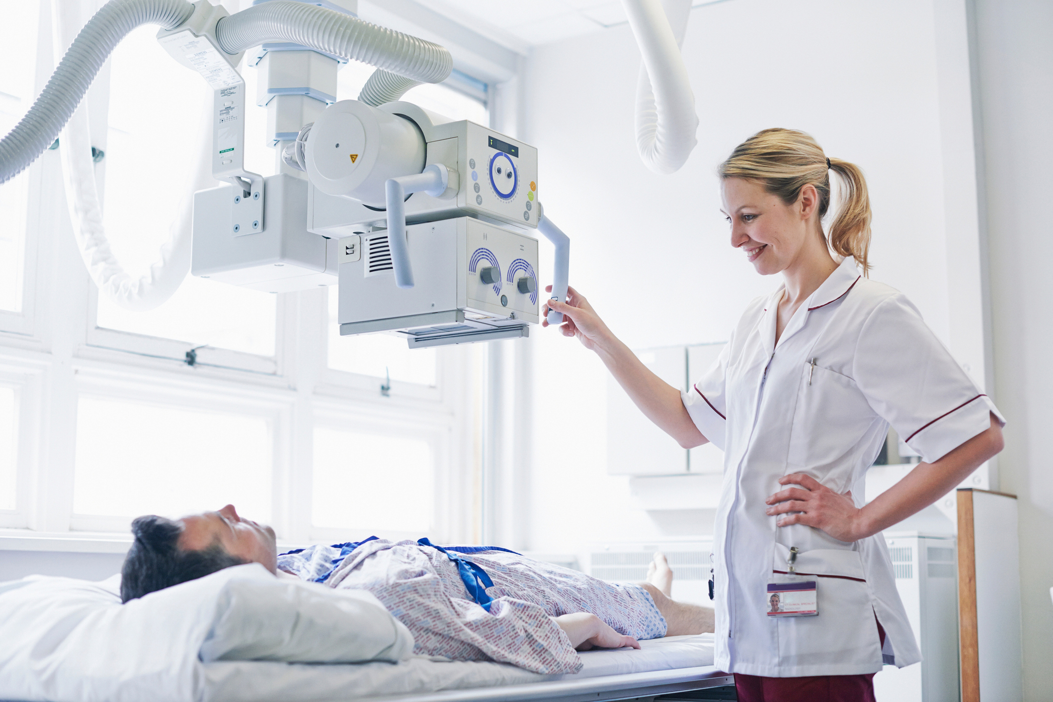 Radiologist scanning patient