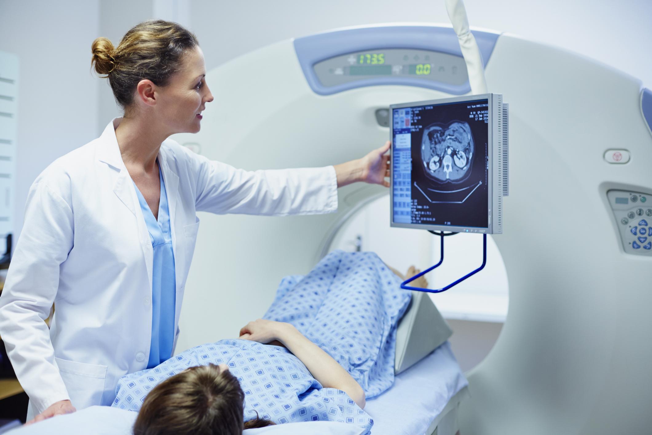 Doctor showing CT scan to patient