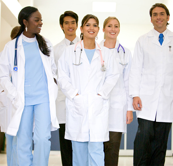 Group of Pharmacy residents walking together down a hospital hallway